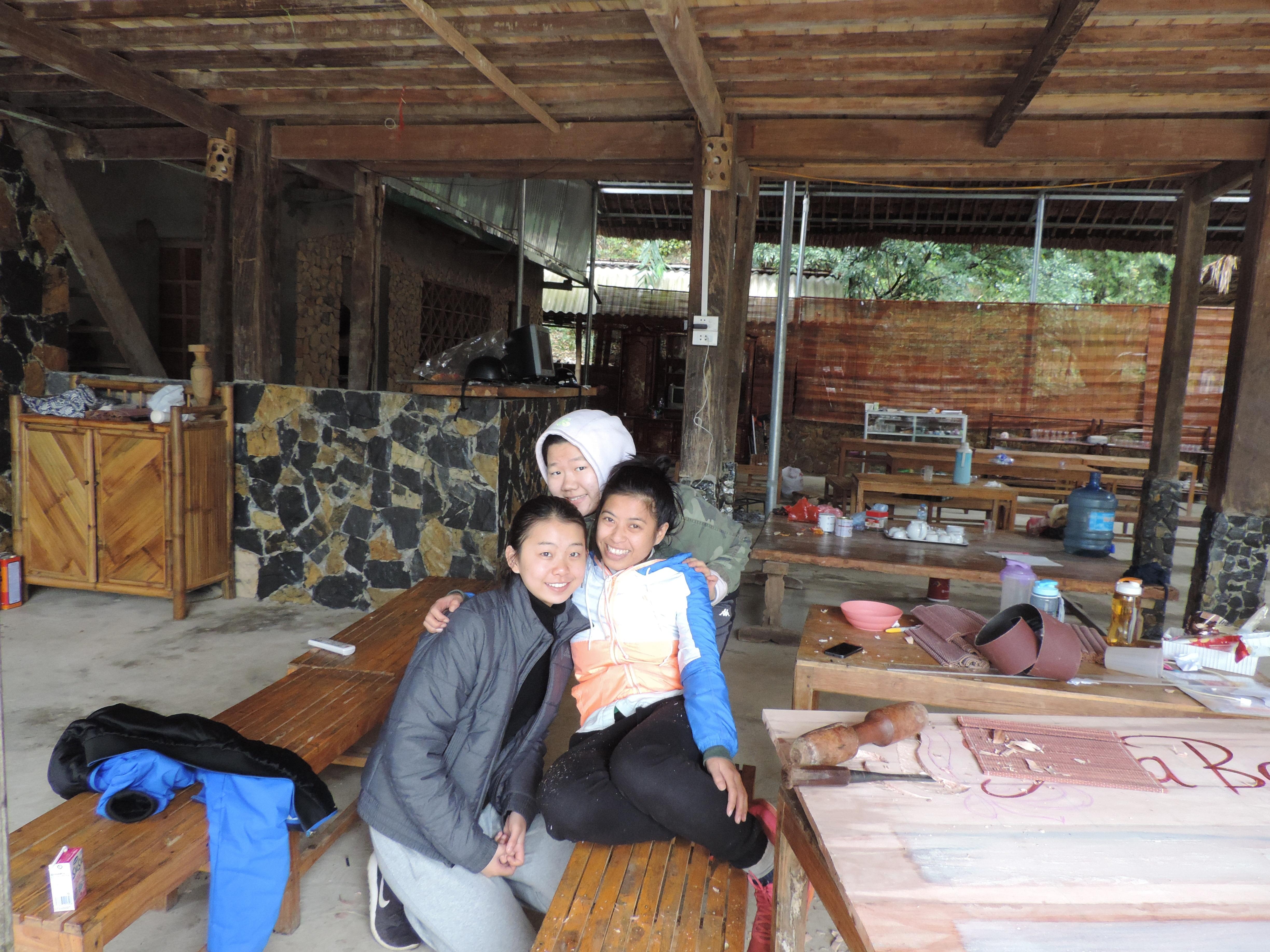 Female Projects Abroad Business Interns pose or a picture in a local arts centre during their Business Internship in Vietnam. Female Business interns pose for a picture whilst at an Art Centre used for making products during their placement in Vietnam.